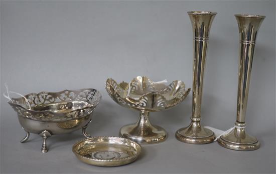 A pierced silver oval dish, a similar circular pedestal dish, a coin-inset dish and a pair of specimen vases.